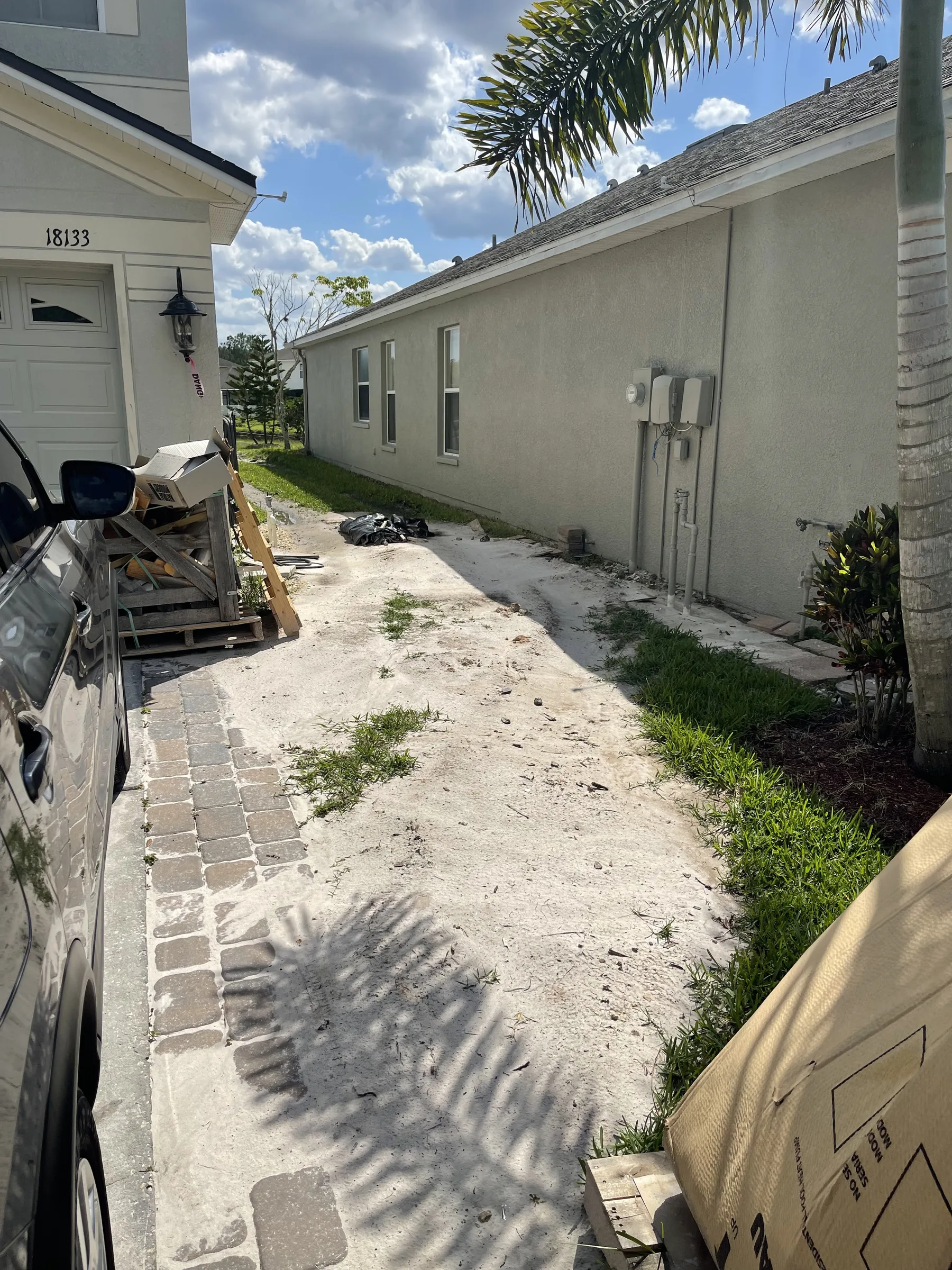 Pavers staged in driveway for new pool build, Odessa FL