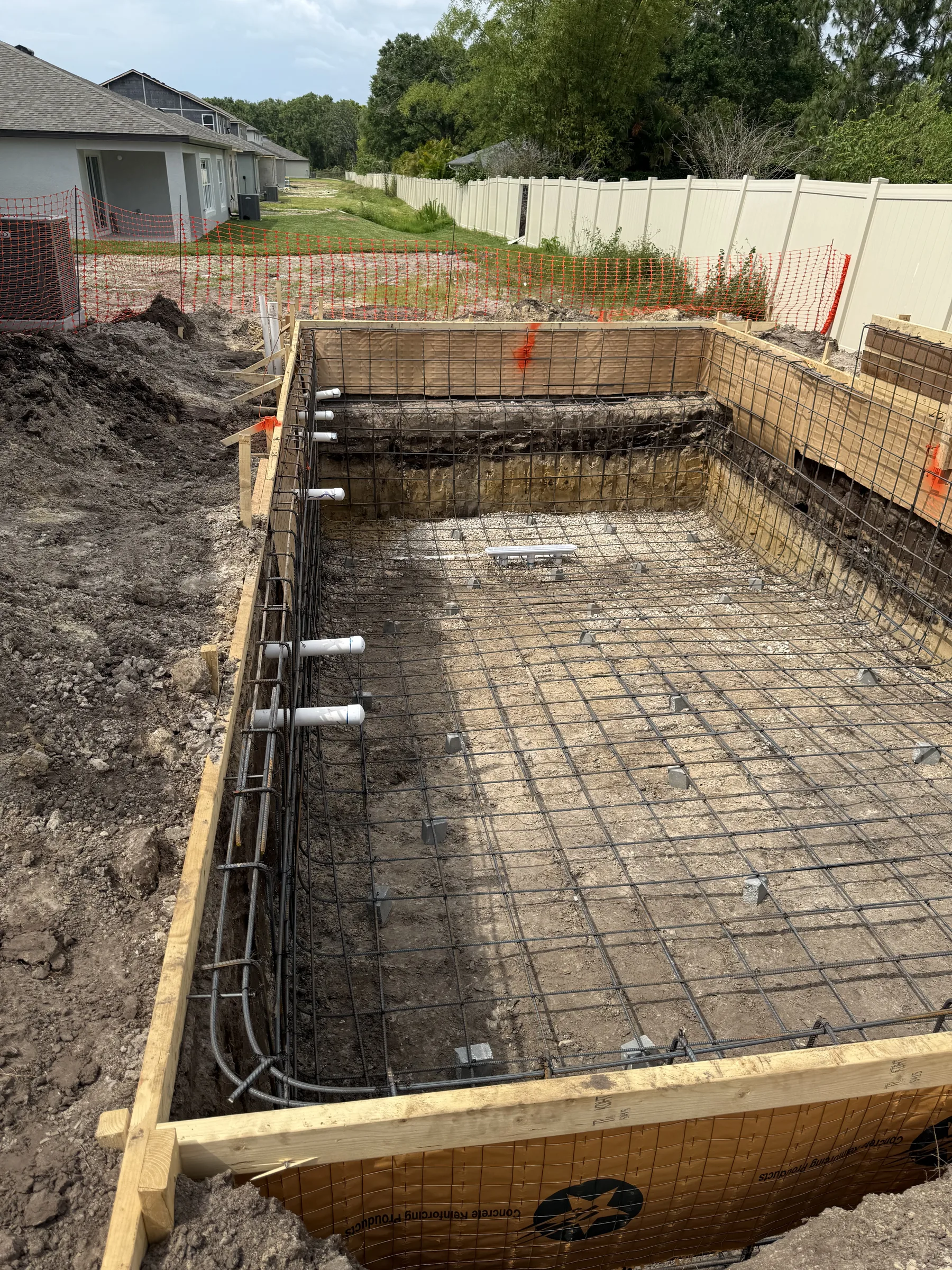 Rebar cage with plumbing stubs before shotcrete, Tampa Bay FL
