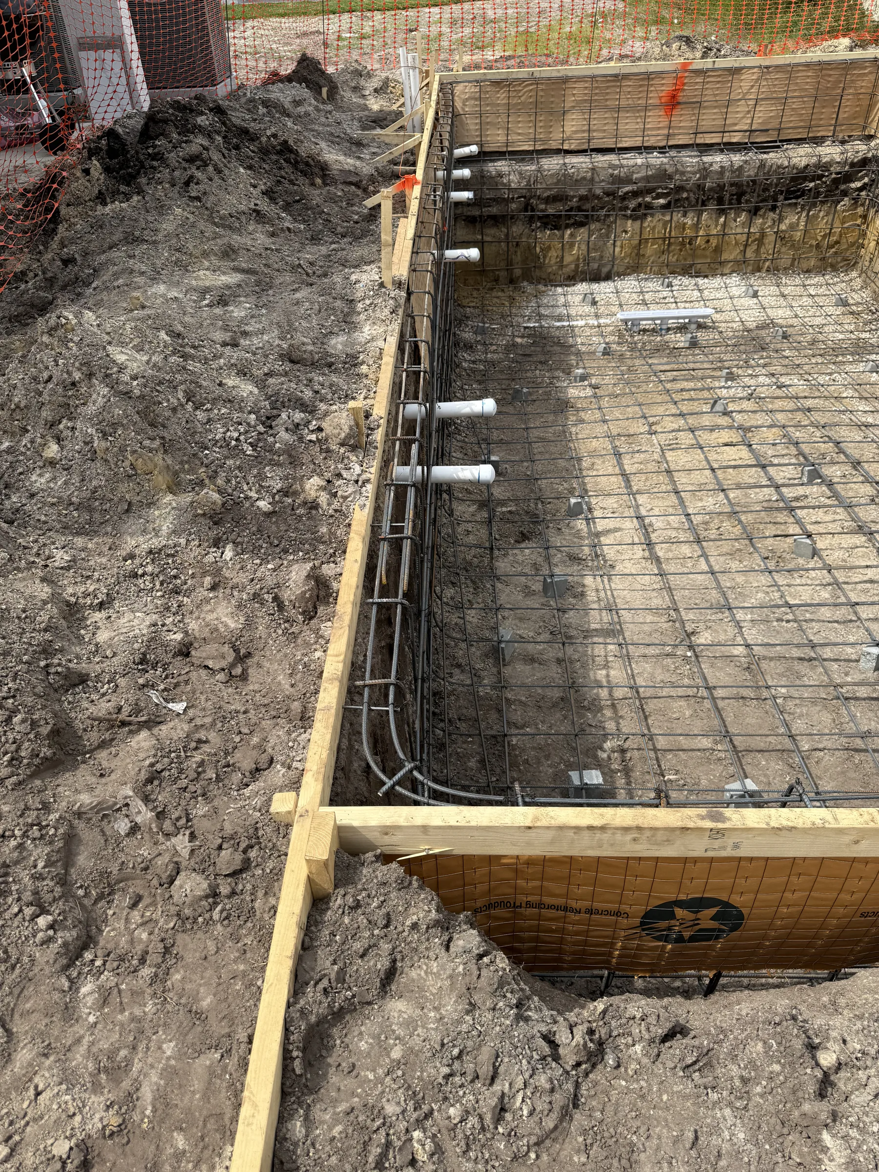 Plumbing rough-in detail with PVC stubs on steel cage, Tampa Bay FL