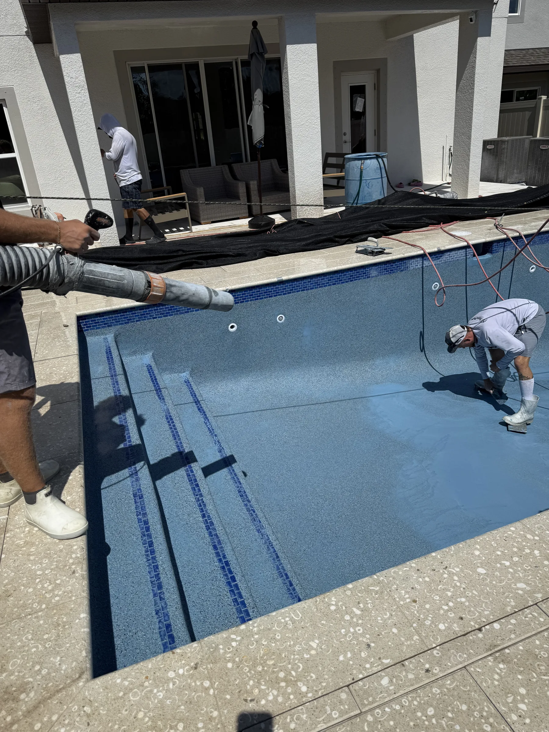 Crew applying Pebble Sheen interior finish, Tampa Bay FL