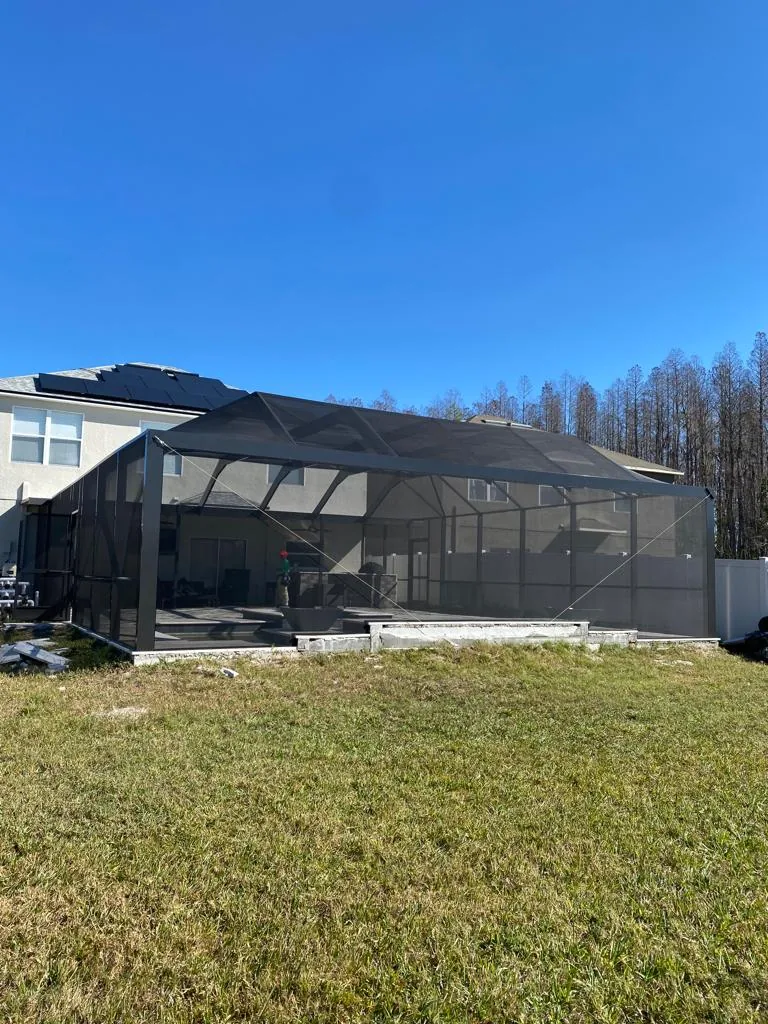 Exterior view of new screen enclosure on finished pool build, Pasco County FL