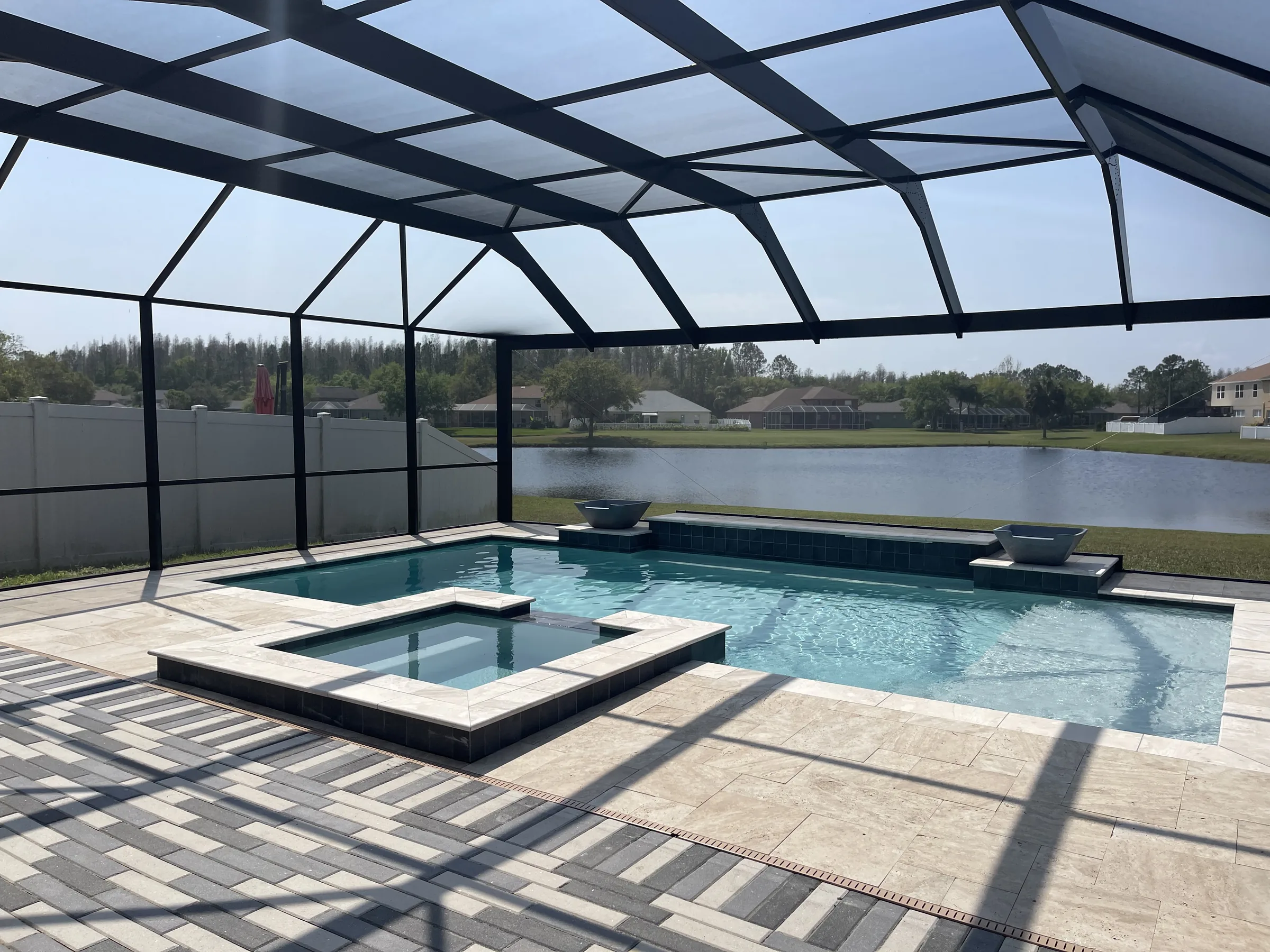Screen-enclosed custom pool and spa with lake view, Pasco County FL