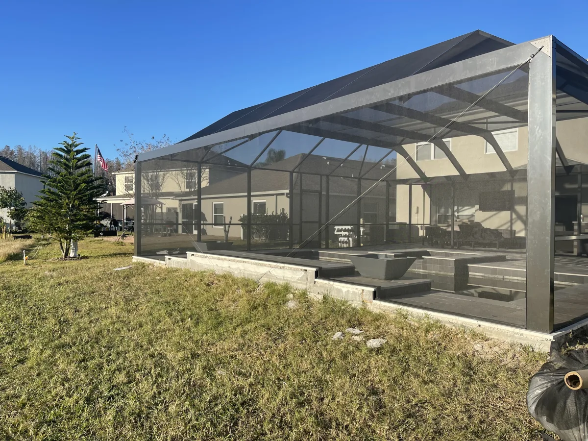 Screen-enclosed custom pool with tile-roof pavilion, Odessa FL