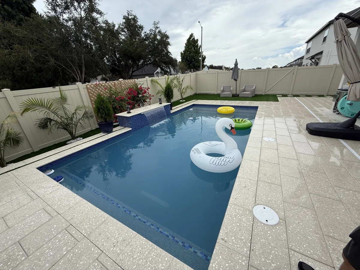 Raised spa with blue mosaic spillover and swan float, Land O Lakes FL